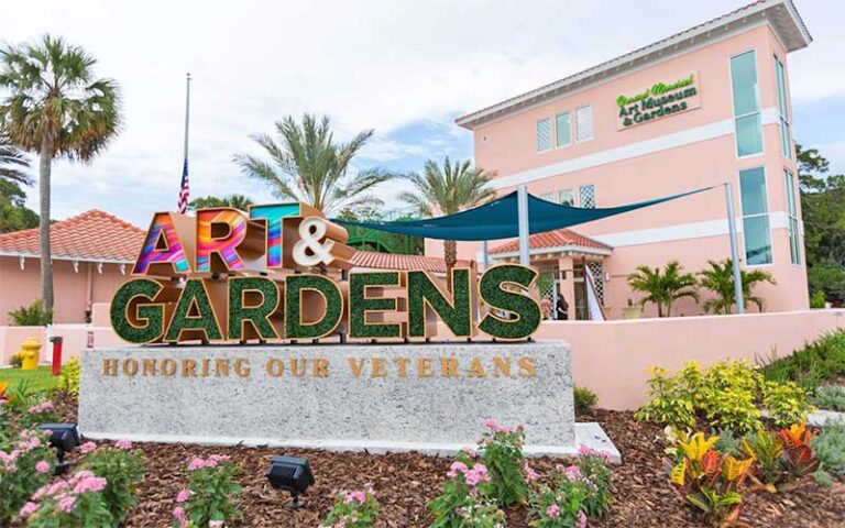 art museum sign with landscaping and building at ormond memorial art museum gardens daytona beach