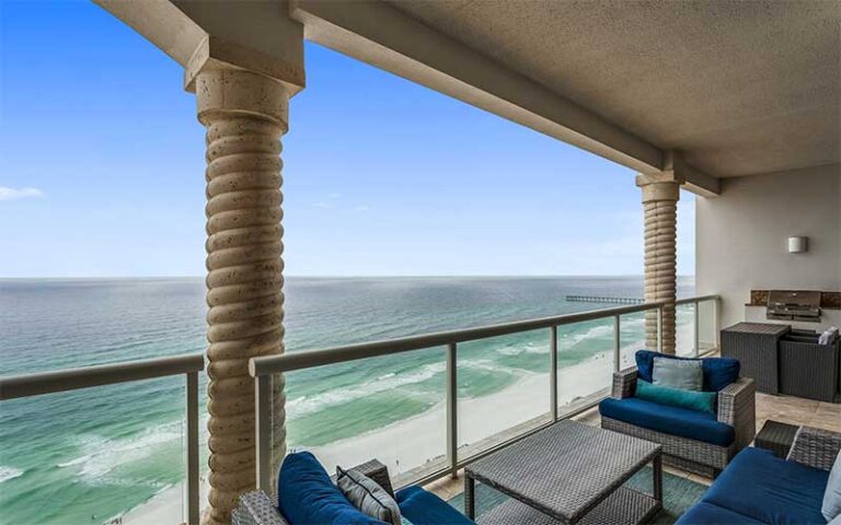 balcony view of gulf with patio seating and columns at beach club resort spa pensacola