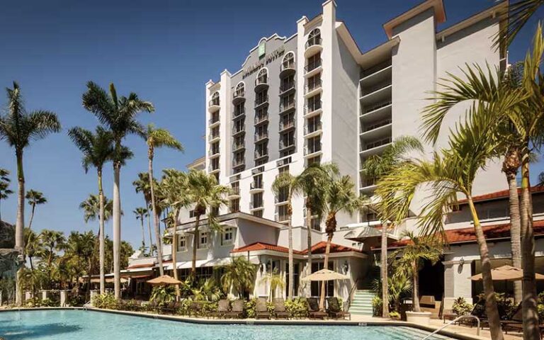 daytime exterior of hotel with pool at embassy suites 17th street fort lauderdale