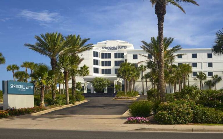 daytime exterior of hotel with sign at springhill suites pensacola beach