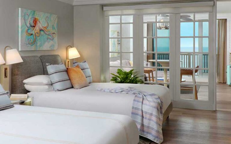 double bed suite with balcony and ocean decor at pelican grand beach resort fort lauderdale