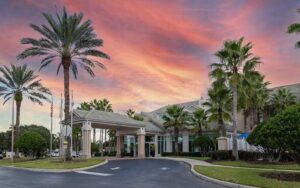 exterior of hotel with twilight sunset at hilton garden inn orlando east ucf area