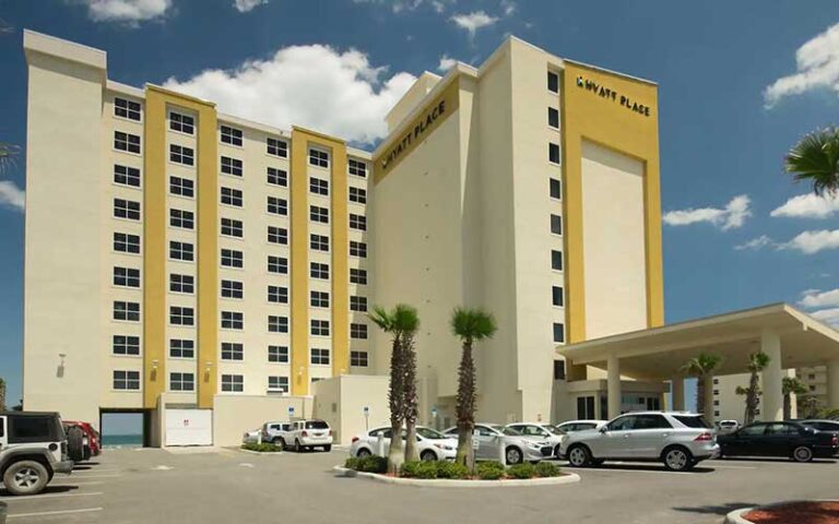 exterior of yellow high rise hotel at hyatt place daytona beach oceanfront