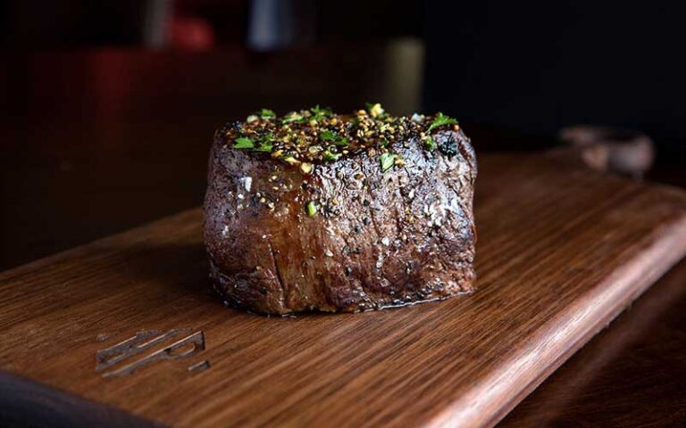 filet mignon on wood board at hyde park prime steakhouse daytona beach