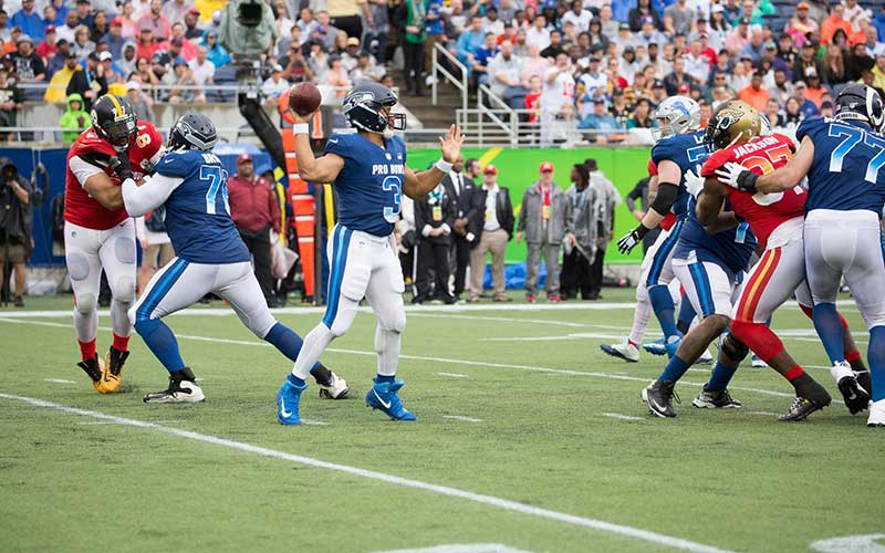 football players on field at camping world stadium orlando