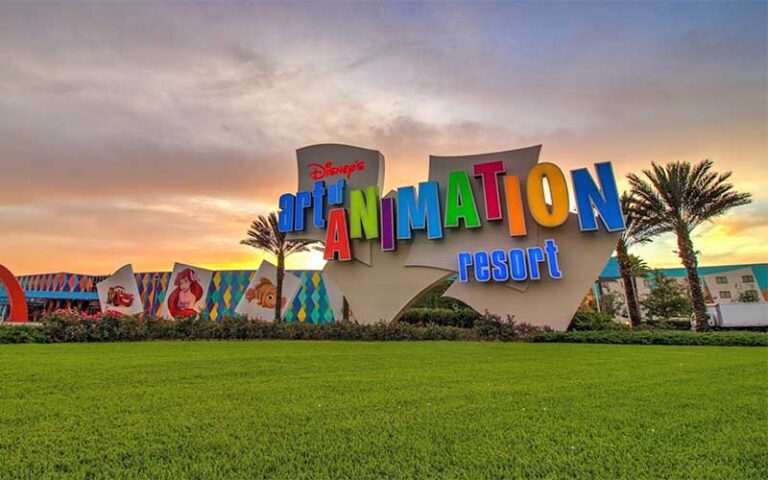 hotel exterior with sign at twilight at art of animation resort walt disney world orlando