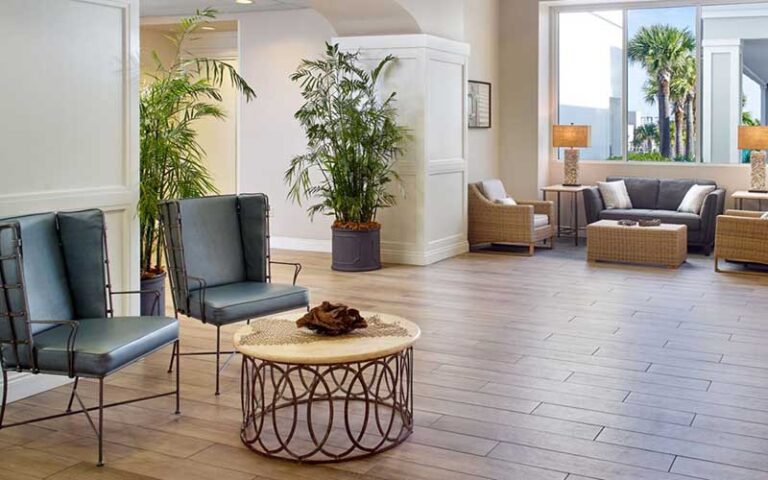 hotel lobby with seating and windows at springhill suites pensacola beach
