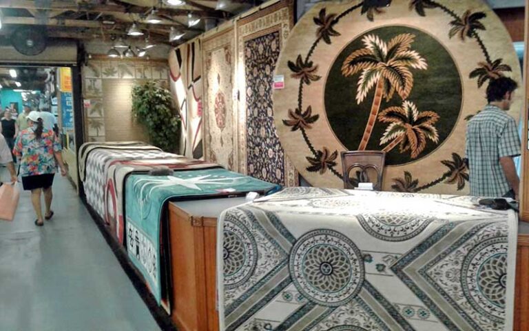indoor shopping area with rug seller at daytona flea farmers market daytona beach