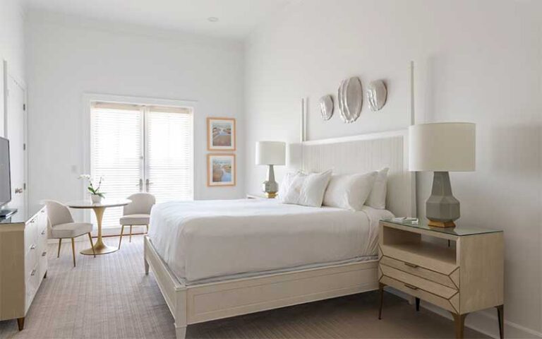 king size bed suite with shells at oyster bay boutique hotel pensacola