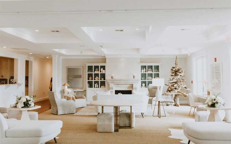 lobby seating area with linen and white at oyster bay boutique hotel pensacola
