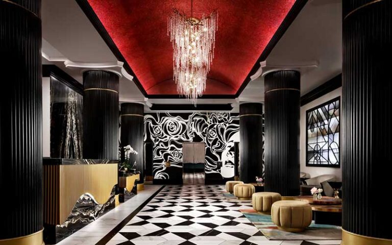 lobby with opulent decor and chandelier at grand bohemian hotel orlando