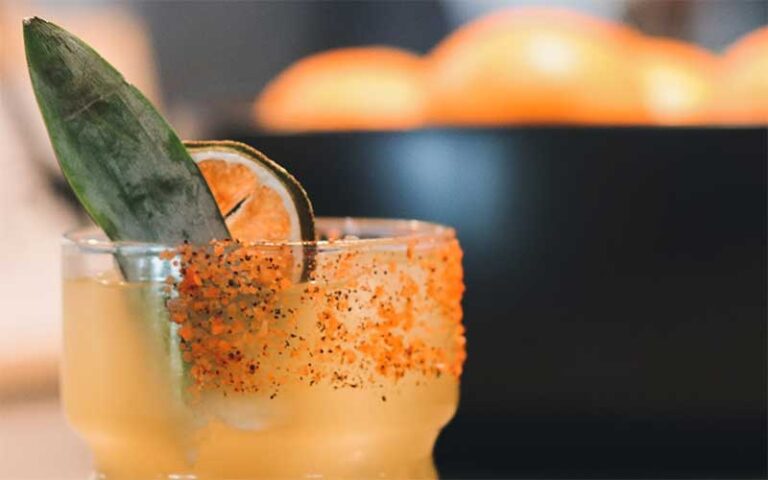 orange cocktail with garnish at the joinery lakeland