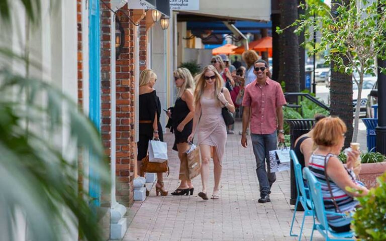 people shopping and walking by sidewalk stores at las olas boulevard fort lauderdale