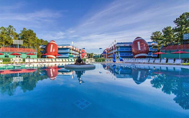 pool area and football themed building at all star sports resort walt disney world orlando
