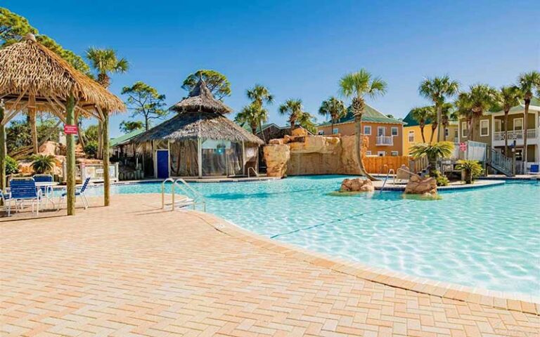 pool area with tiki hut at purple parrot village resort perdido key pensacola