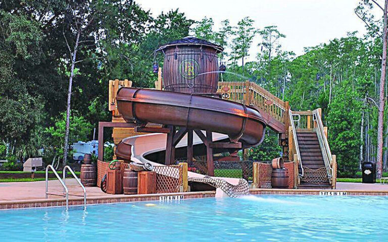 pool area with water tower slide at cabins at fort wilderness resort walt disney world orlando