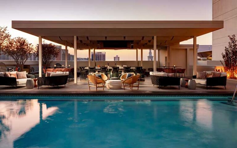 rooftop pool with seating at grand bohemian hotel orlando