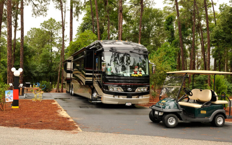 rv parked with golf cart at campsites at fort wilderness resort walt disney world orlando