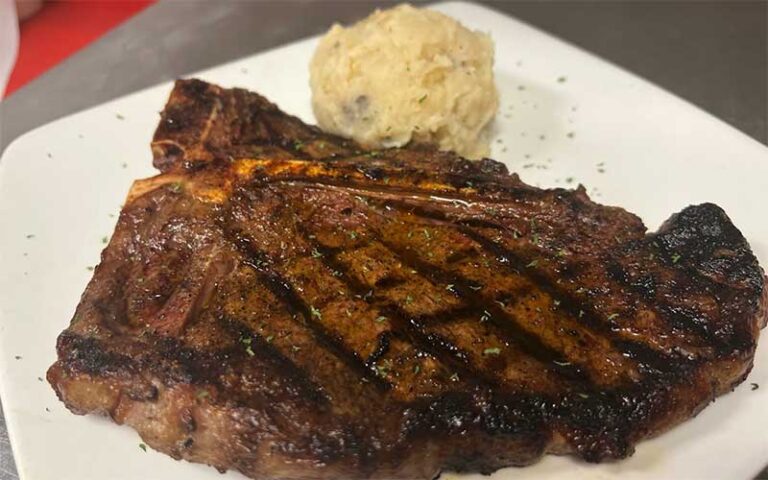 t bone steak with side at ovation bistro bar winter haven