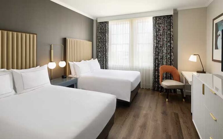 double queen bed suite with wood floor at the terrace hotel lakeland