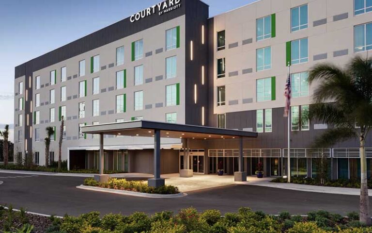 front exterior at dusk with entrance at courtyard winter haven