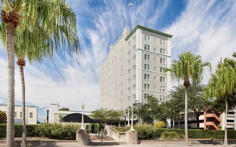 hotel exterior from promenade with palms at the terrace hotel lakeland
