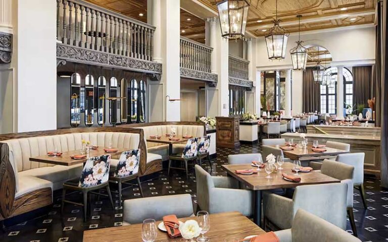 lobby dining area with chandeliers at the terrace hotel lakeland