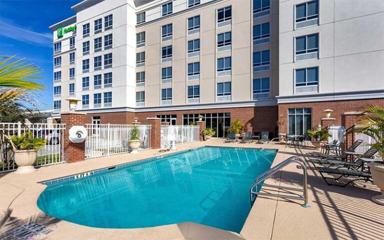 pool area with hotel in background at holiday inn winter haven