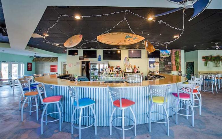bar interior with seating and surf decor at ocean coast hotel at the beach amelia island