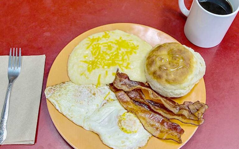 breakfast plate with eggs bacon grits and coffee at t rays burger station fernandina beach amelia island