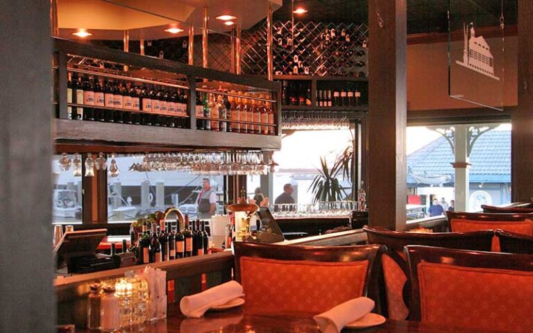 dining interior with bar and red seating at bretts waterway cafe fernandina beach amelia island