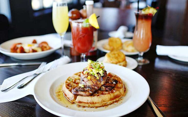 chicken and waffle entree with brunch table setting at the grand marlin panama city beach