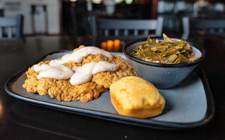 country fried steak with gravy and sides at the wicked wheel panama city beach