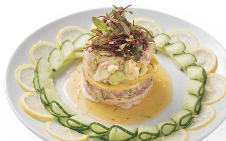 crab cake with lemon and lime on plate at firefly panama city beach