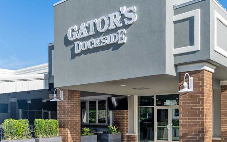daytime exterior of restaurant with patio at gators dockside gainesville