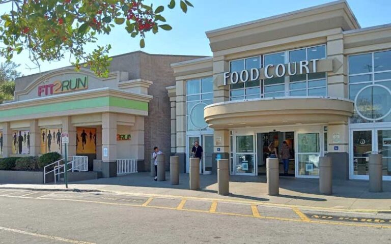 exterior parking lot view of storefronts at the oaks mall gainesville