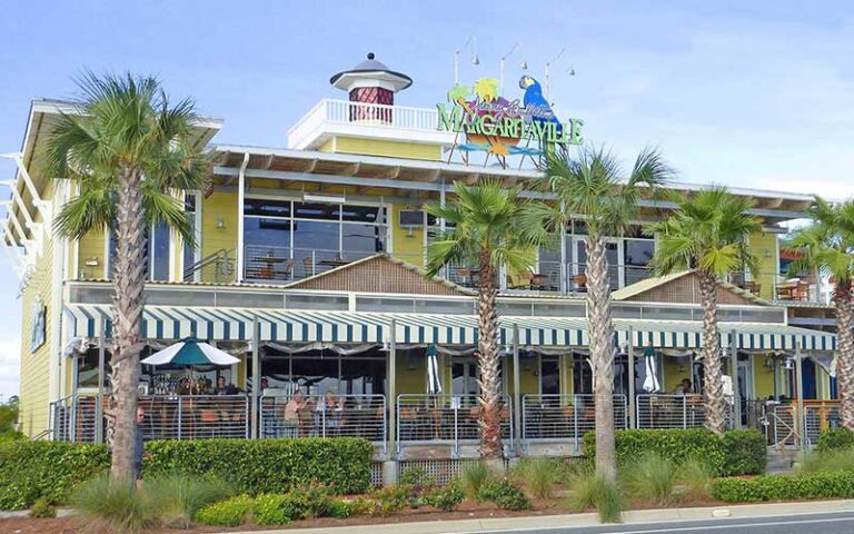 front exterior of island themed two story restaurant at margaritaville panama city beach