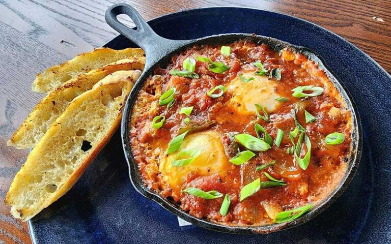 pasta dish in frying pan with bread at the grand marlin panama city beach