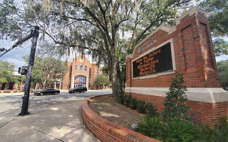 red brick park sign with university of florida logo at ben hill griffin stadium gainesville