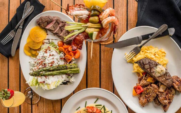 tabletop with entrees and drinks at the grand marlin panama city beach
