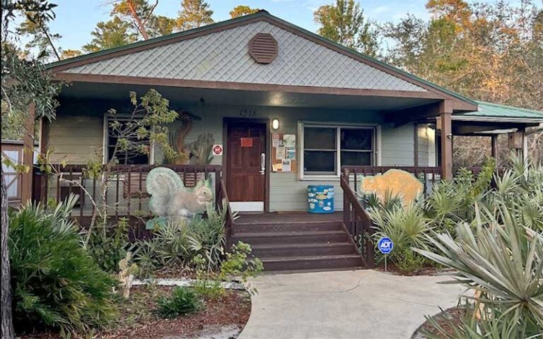 exterior of cabin style visitor center at turkey creek sanctuary palm bay