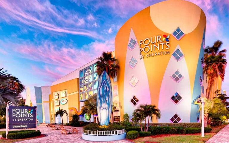 front exterior of hotel with twilight sky at four points by sheraton cocoa beach