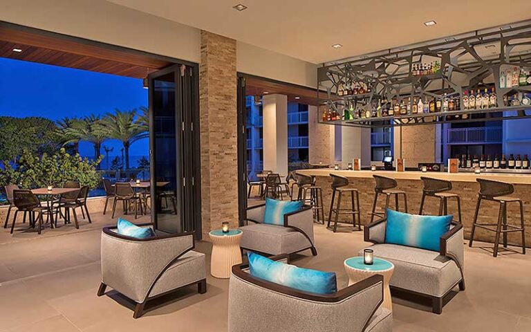 restaurant with patio at night at zota beach resort longboat key