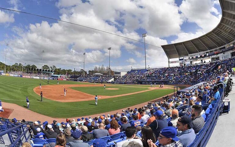 baseball field with game and crowded stands at clover park port st lucie