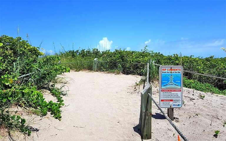 beach access path with rip current sign at frederick douglass memorial park fort pierce