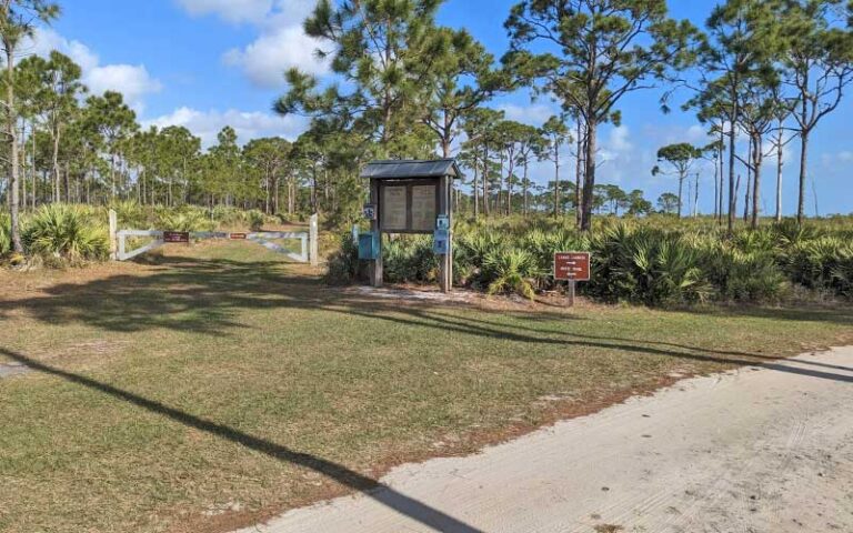 boat launch paths with sign in forest at savannas preserve state park port st lucie