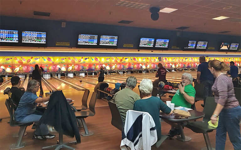 bowlers seated around lighted lanes at shore lanes palm bay melbourne