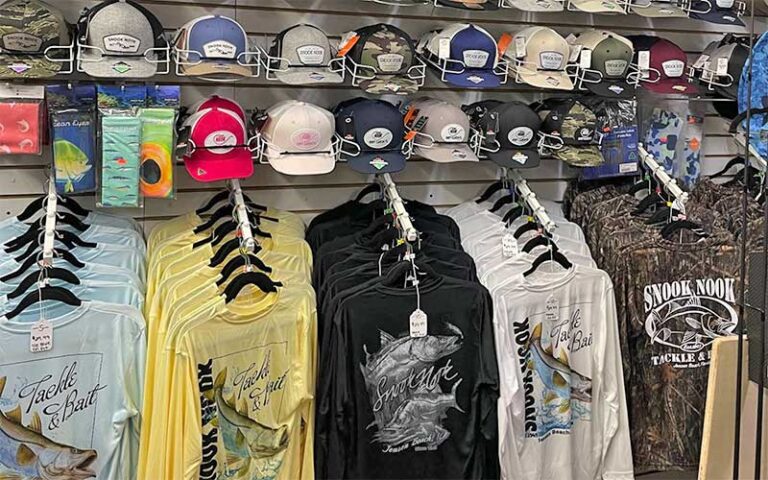 brand hats and shirts on wall rack at snook nook discount bait tackle jensen beach