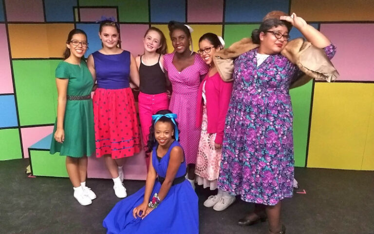 cast of young actresses on stage at amelia musical playhouse fernandina beach
