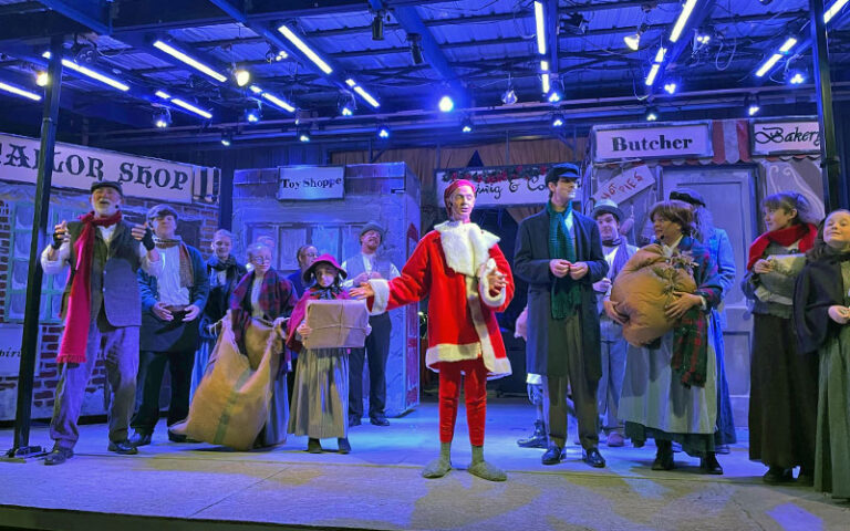 christmas carol performers on stage at amelia musical playhouse fernandina beach